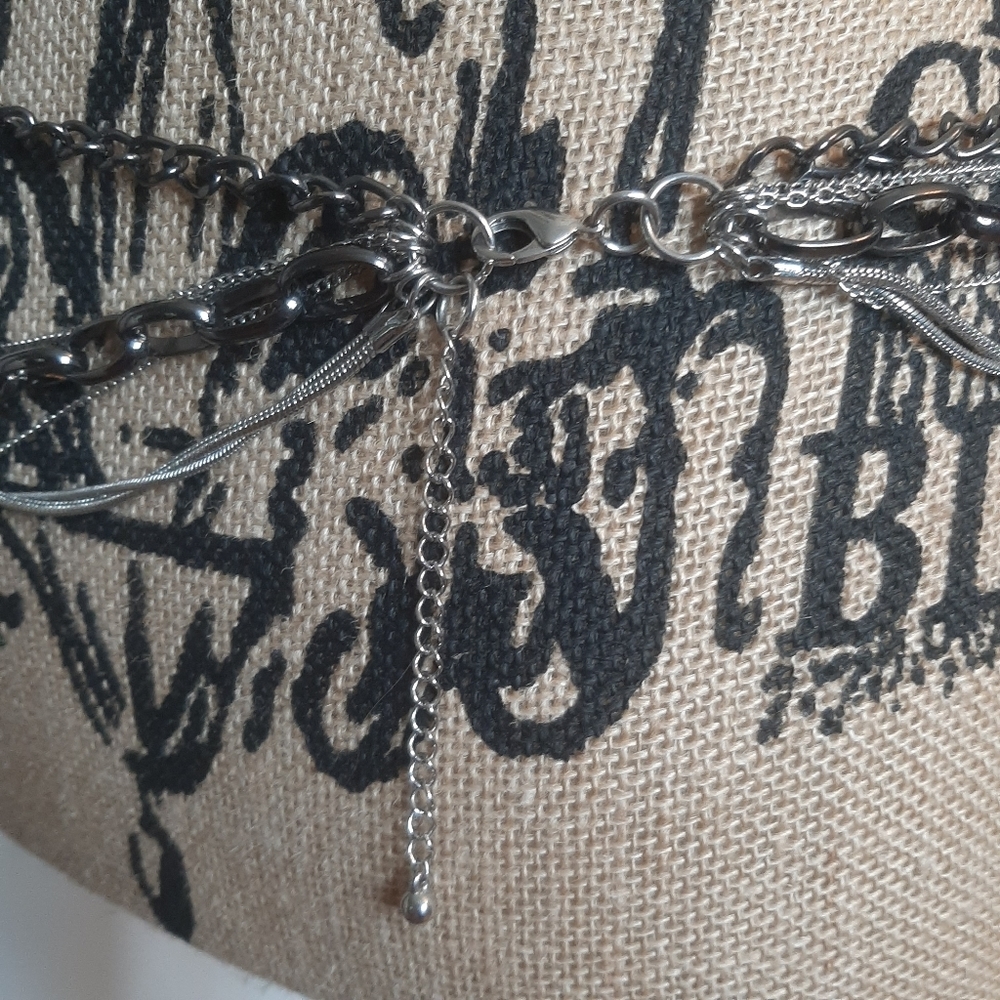 Multi strand chain adjustable belt.  Q4